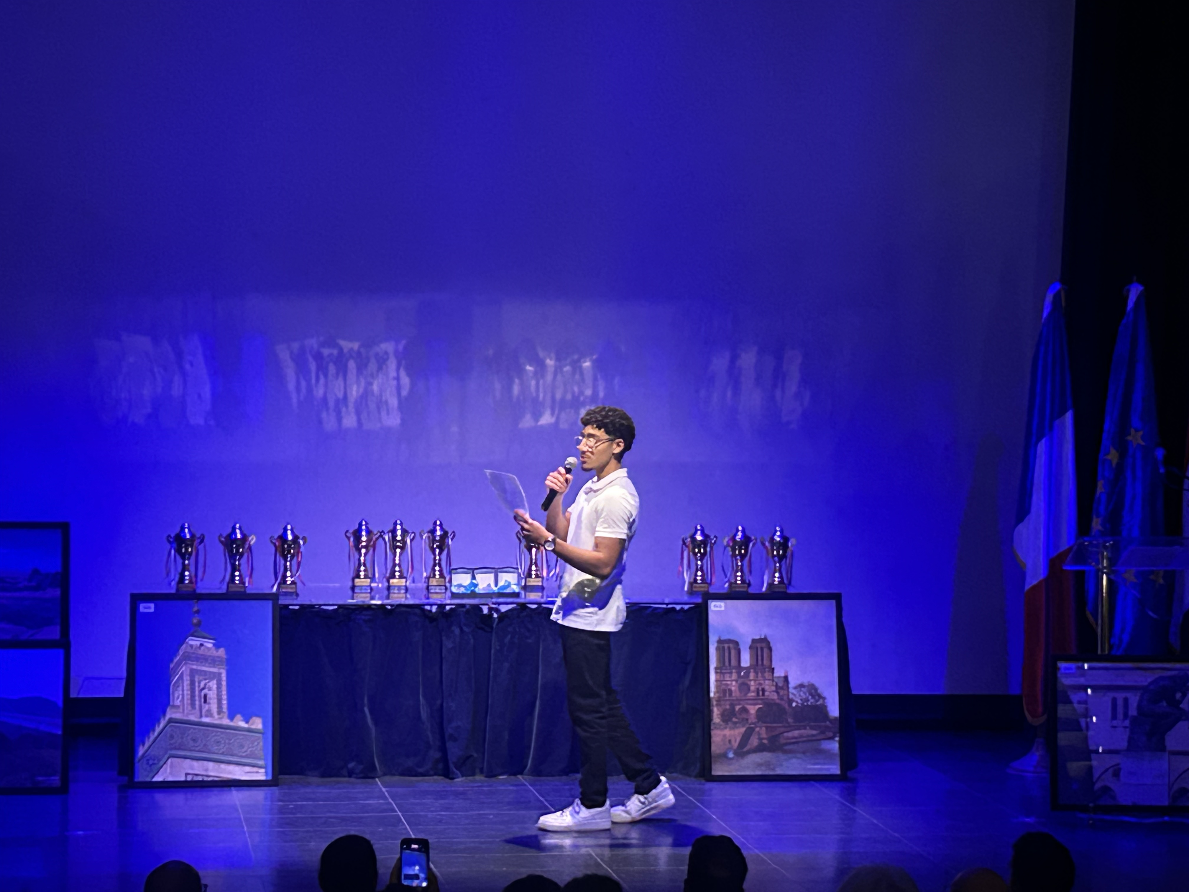 SkyPrep founder Amir Khalifa on stage at the Institut Français ceremony receiving the Civic Achievement Award